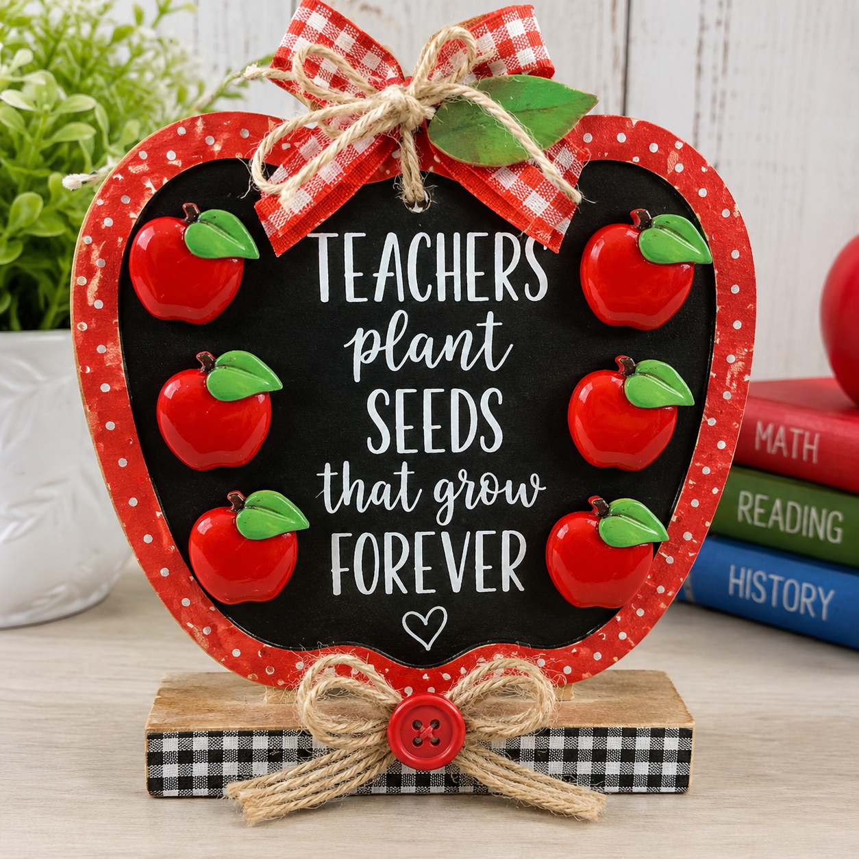 big-red-apple-buttons-teacher-plaque-craft.jpg Handmade teacher appreciation plaque featuring six glossy red apple craft buttons with green leaves.