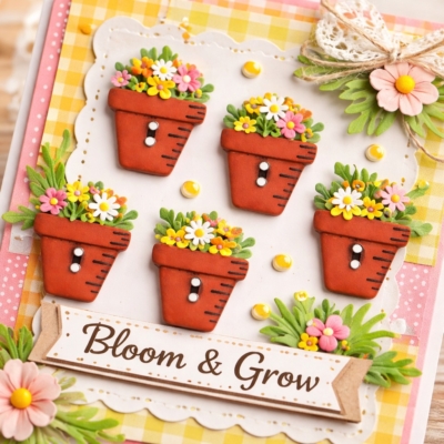 Handmade spring card featuring 1 inch clay flower pot buttons decorated with colorful flowers and greenery with Bloom and Grow message