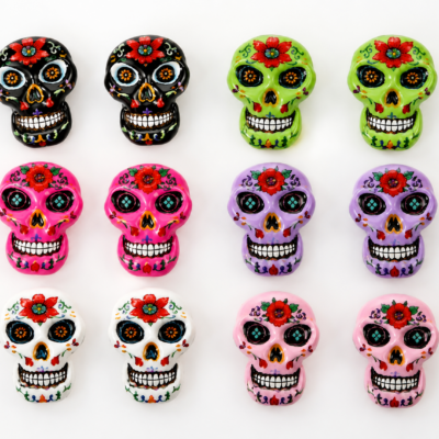 Tiny sugar skull craft embellishment set with colorful floral skulls in six colors